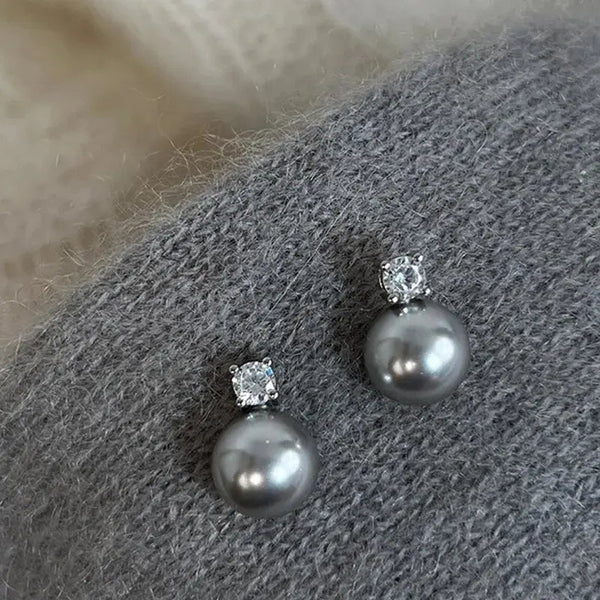 Boucles d'oreilles élégantes en perle noire et zircone